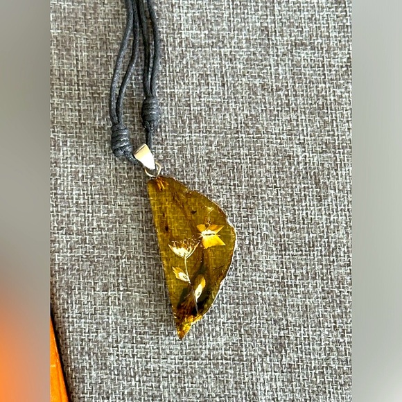 Amber Carved Flower Butterfly Blue Florescence Pendant Black Cord Necklace - Picture 3 of 6